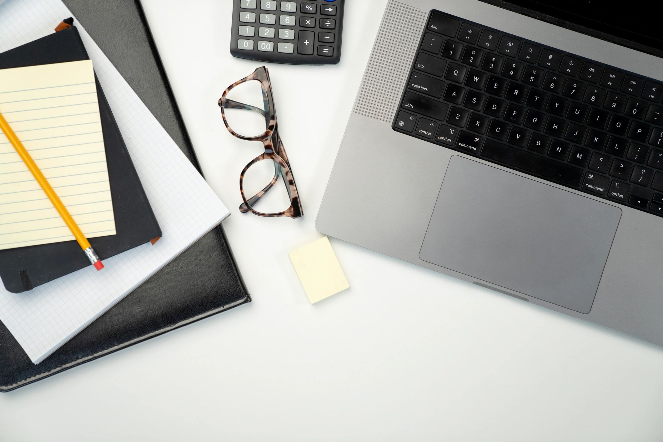 Tax documents and calculator on a desk