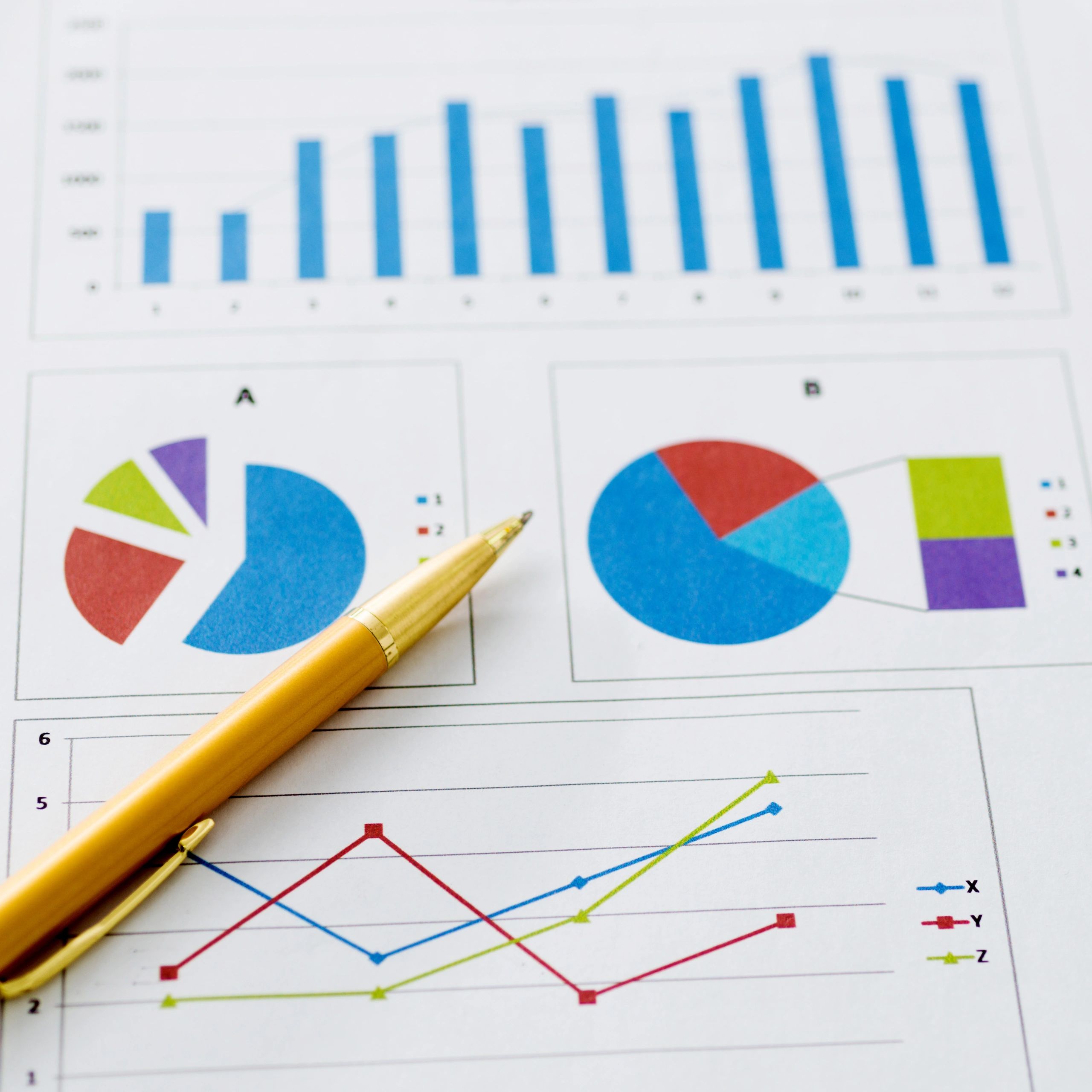 Pen on financial charts for tax planning